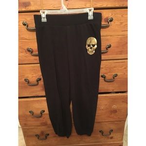 Black w/ hold skull design and fitted ankle sweats